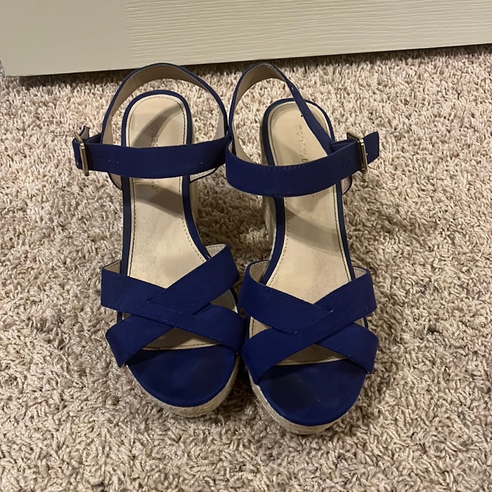 Size 9.5 beautiful blue wedges!! Perfect for summer.. gently worn